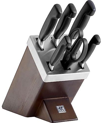 Zwilling Four Star 7pc Knife Block Set. Forged Special Formula stainless steel. Ice-hardened. Ergonomic handle. Set: 4 kitchen knives, honing steel, self sharpening block +shears. Made in Germany