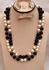A Beautiful Necklace Of Off White And Black Beads