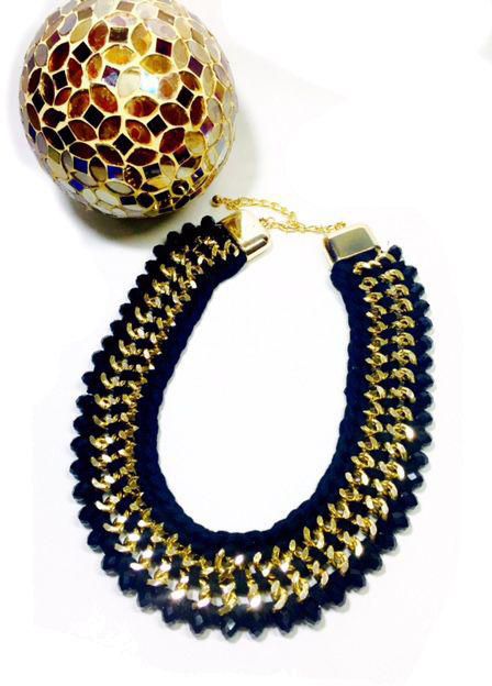 Black held a black crystals decorated with golden metal chains - 2193