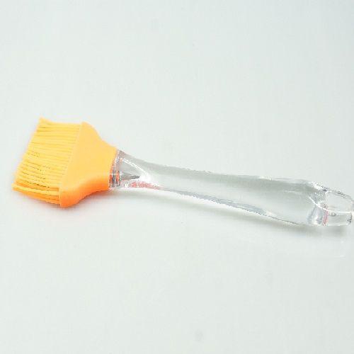 Silicone cooking brush with transparent hand and orange brush