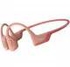 Shokz OpenRun PRO Bluetooth headphones in front of ears, pink | Gear-up.me