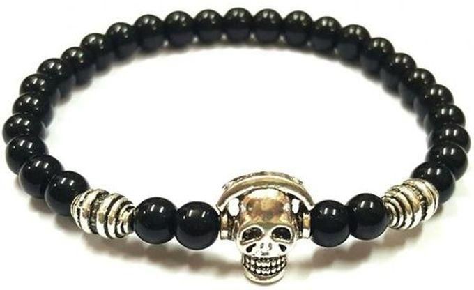 Black beads bracelet with a skull metal charm of Elegance.O.K.M