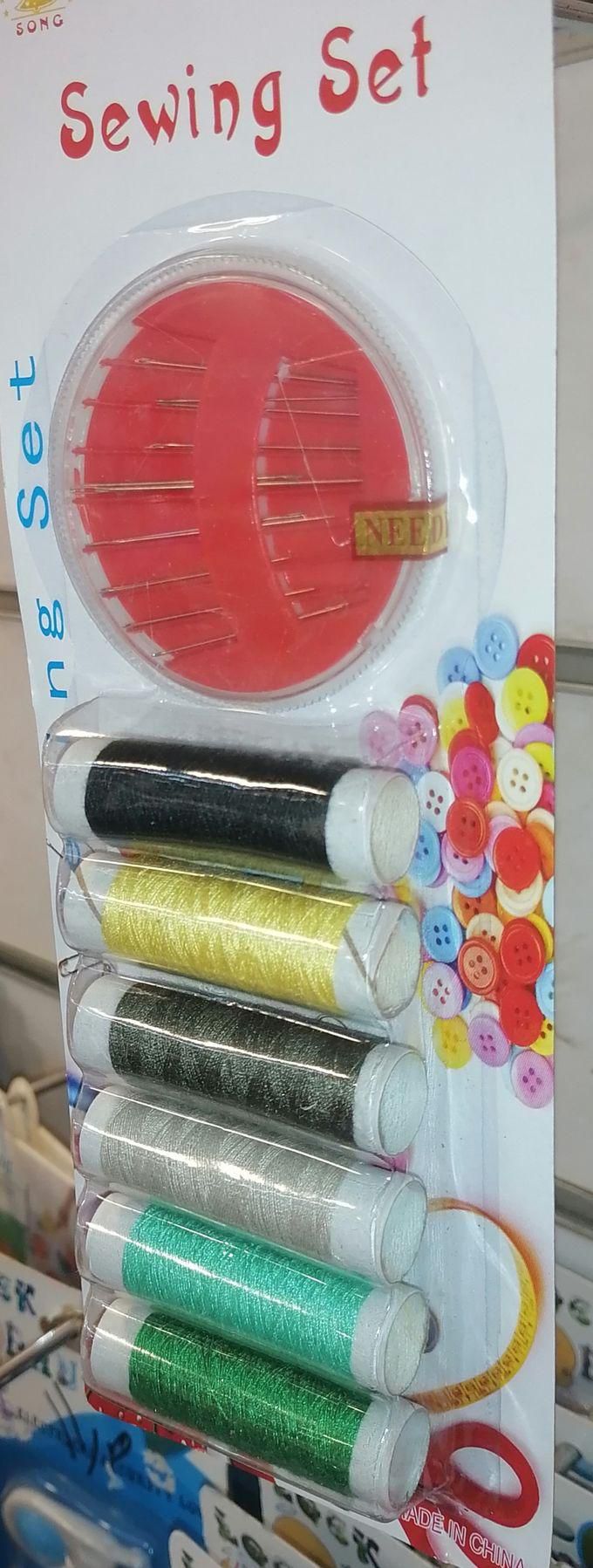 Multi-colored Thread Bobbins + Sewing Needles Of Different Sizes. Sewing Supplies