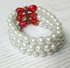 Fashion Pearl bracelet with a red flower