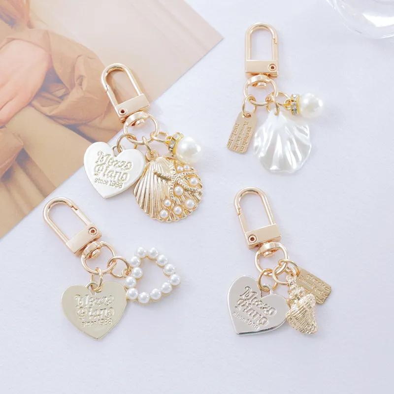 【Special Offer】A Set of 4 Pcs Metal Key Chain Exquisite Accessories Lovely Shell Key Pendant Bag Pendant Set Creative Gifts Heart Type Conch Decoration
