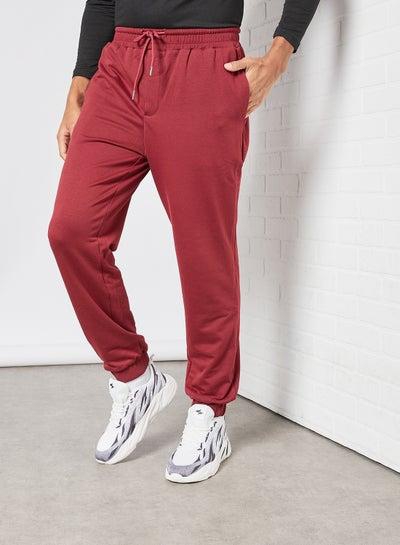 Casual Sweatpants with Elasticated waistband and back decorated pockets Maroon