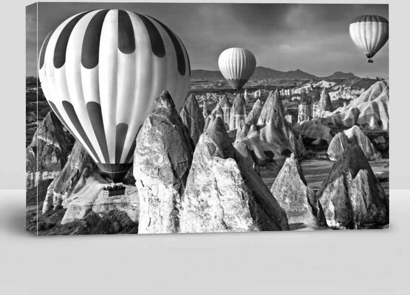 Black-and-White Contrast Picture of the Balloons Flying Over Canyons