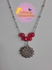 An Elegant Rose Flower Necklace With Red Beads