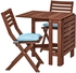 ÄPPLARÖ طاولة وكرسيان قابلان للطي، الأماكن الخارجية، بني/ مطلي، Kuddarna أزرق فاتح