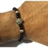 Black Beads Bracelet With A Metal Charm