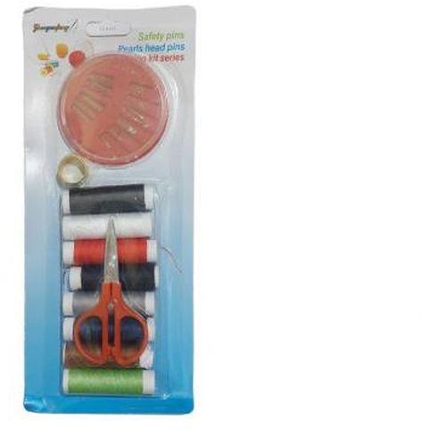 A Set Of Sewing Needles, A Set Of Multi-colored Sewing Bobbins, And Small Scissors