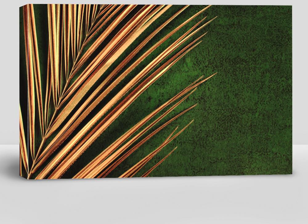 Closeup of Golden Palm Leaf on Abstract Dark Green