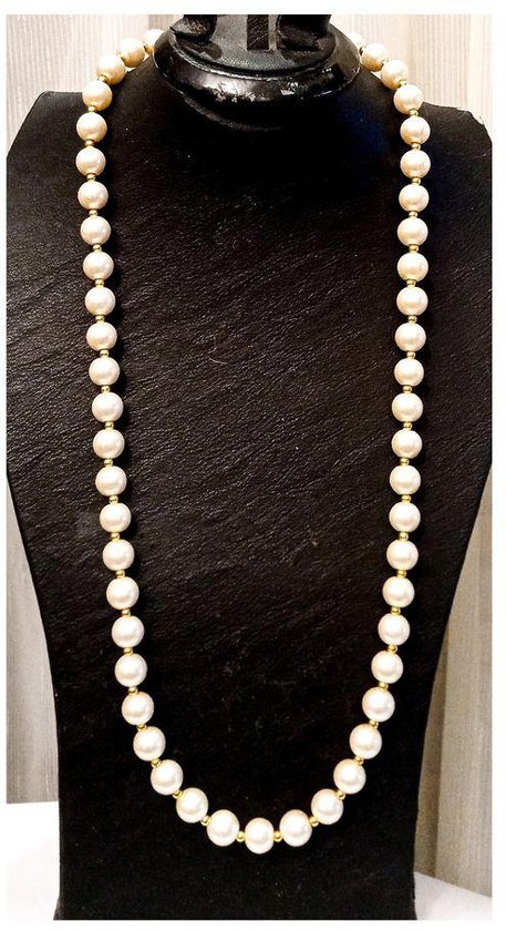 A Beautiful Necklace Of Off White Beads